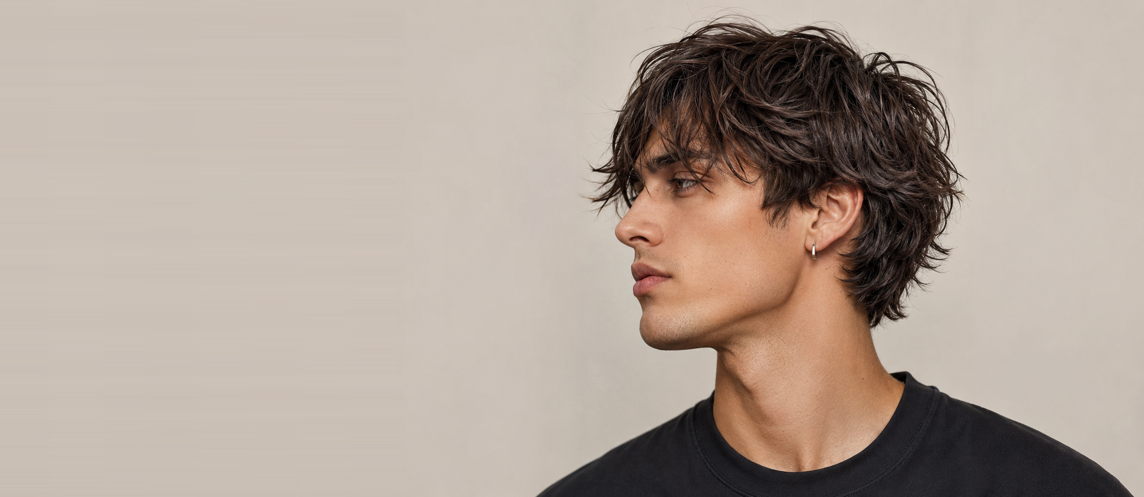 A textured, layered men's cut shot in profile